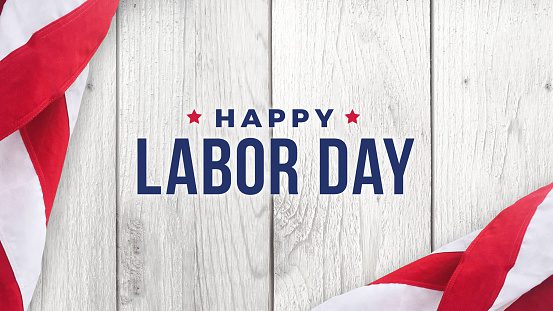 Happy Labor Day Text Over White Wood and American Flags