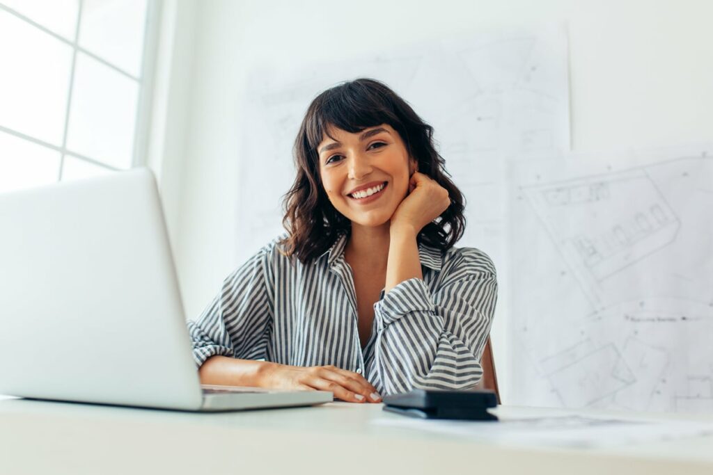 Office worker smiling using Microsoft Teams | BC Networks